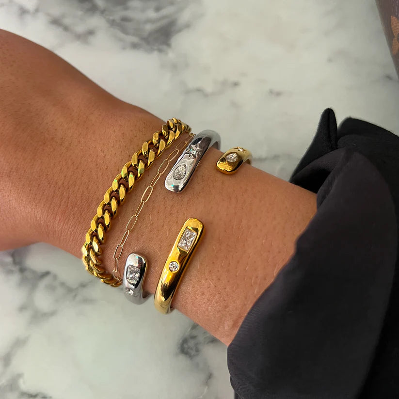 thin cuff adorned with rectangle-shaped crystal and delicate round crystal