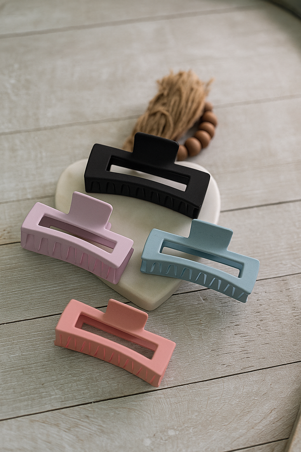 Black, Lavender, Carolina Blue and pink matte hair claw clip with curved open design for everyday styling