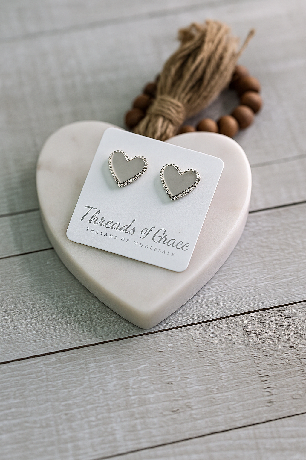 Silver heart-shaped stud earrings with minimalist design