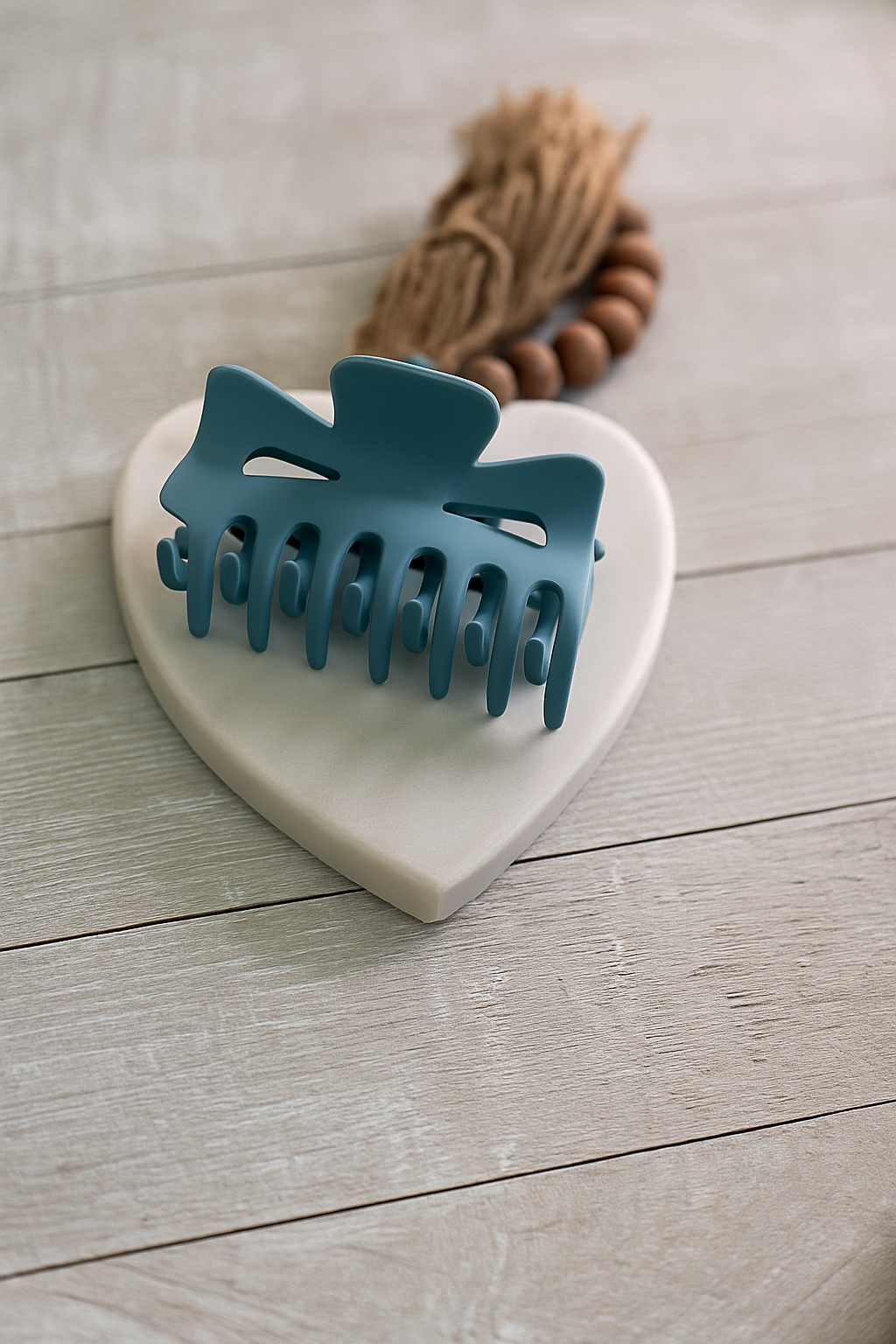 Teal matte finish claw clip with wide grip and soft-touch texture