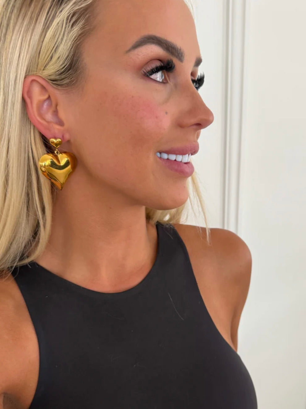 Double heart gold dangle earrings