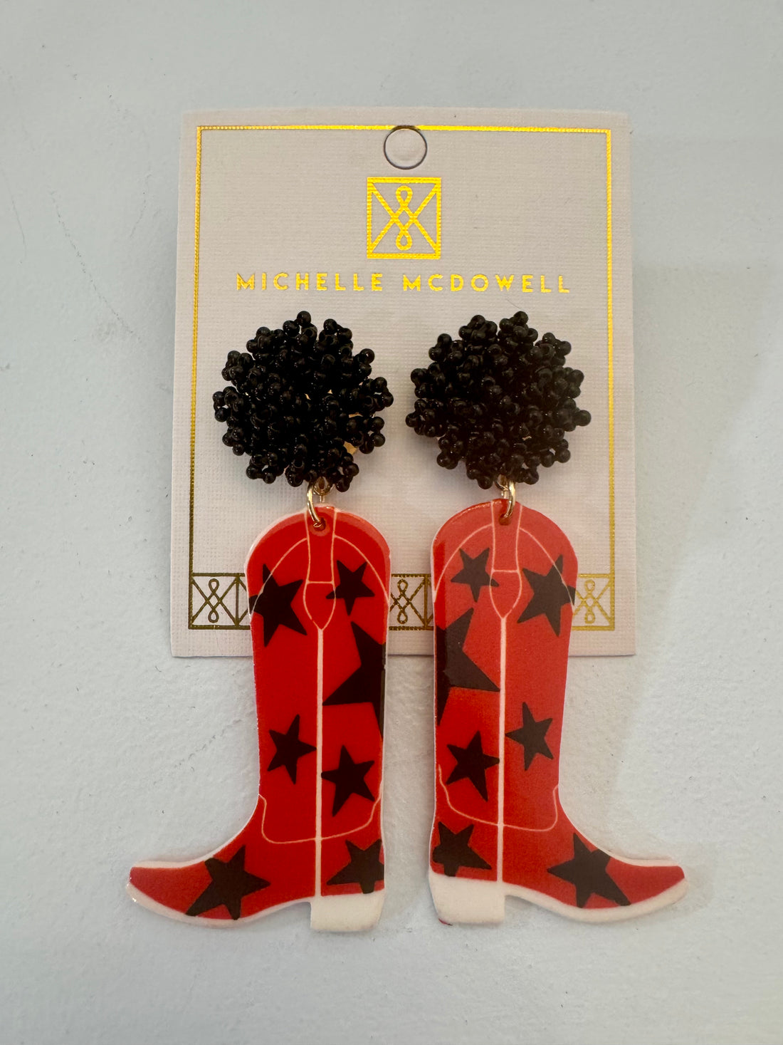 Red and black boot star earrings