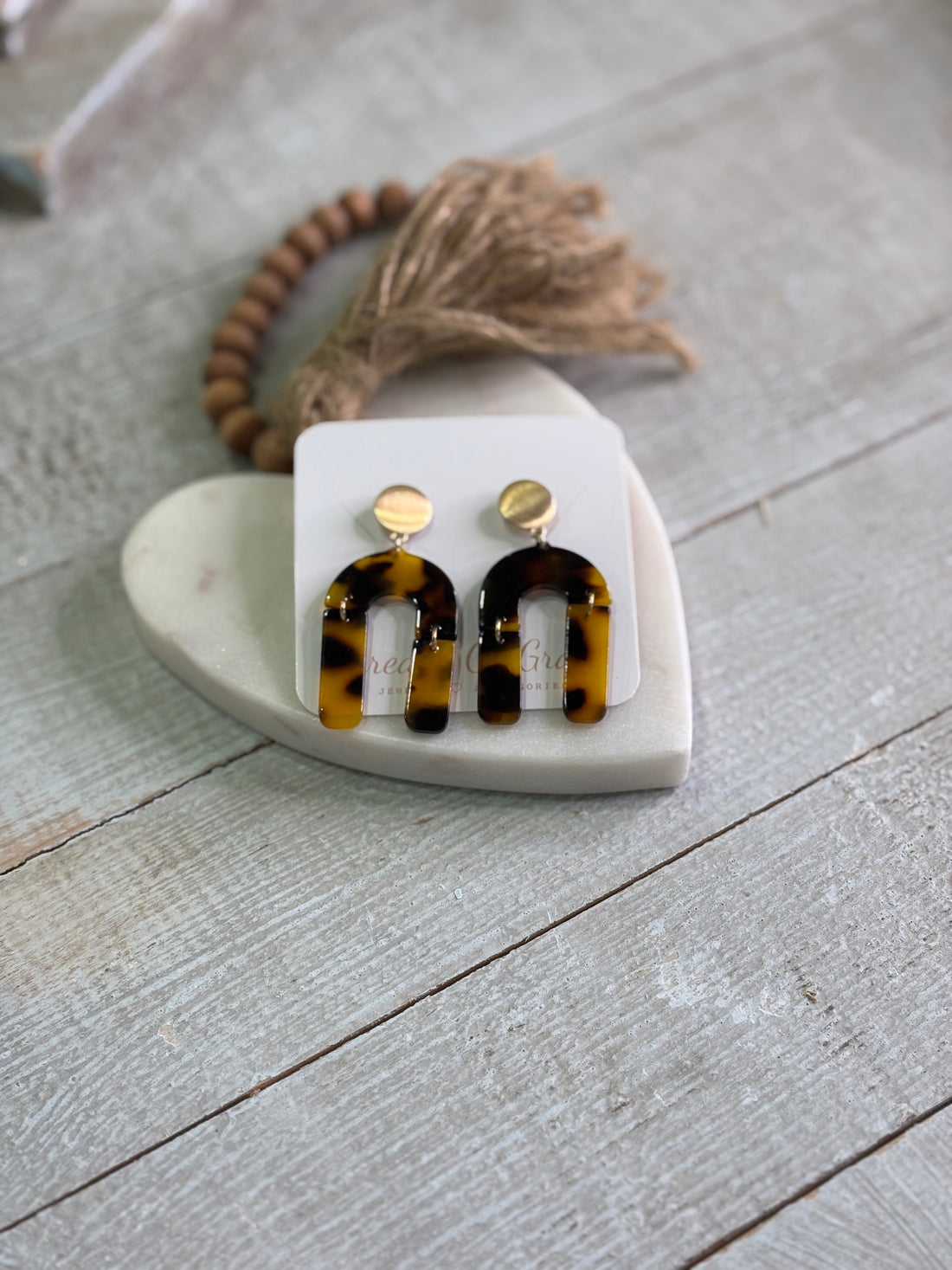 Earrings with a fresh take on tortoise shell style, featuring a sculptural U-shaped silhouette that dangles just right