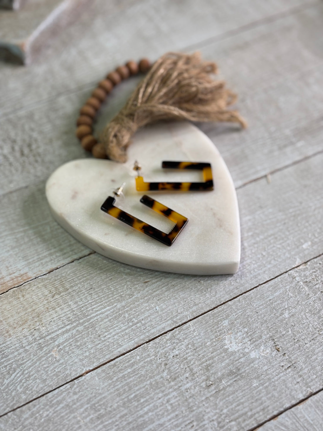 Hoops that feature a sleek rectangular silhouette in a classic tortoise shell