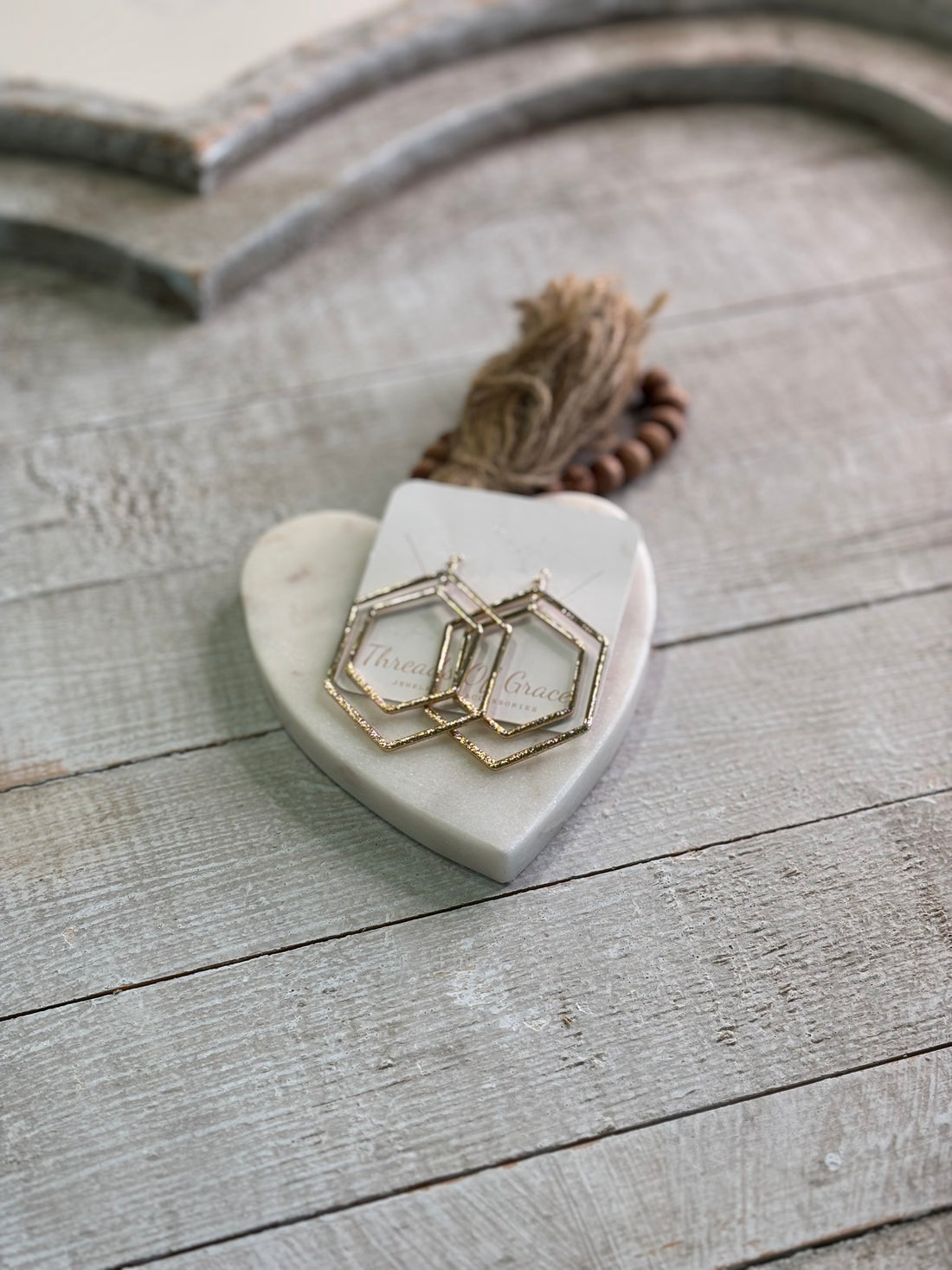 Hexagon shaped gold hoops.