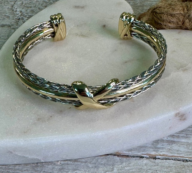 Twisted silver braided base and Gold-plated trim and accents