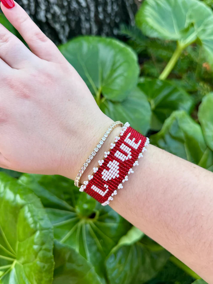 Beaded LOVE cuff with red background