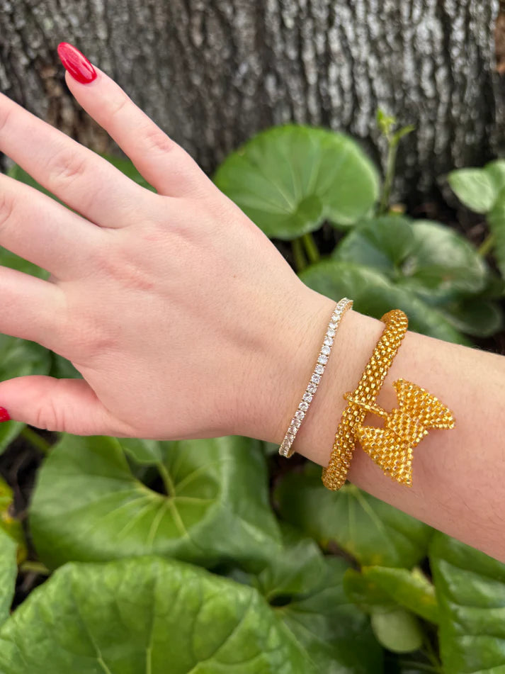 Gold bow charm bracelet