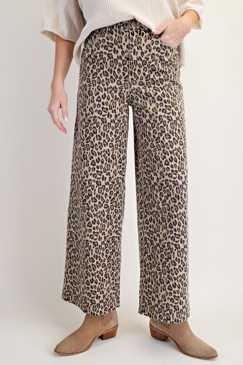 Leopard print jean style pant with unfinished hem.