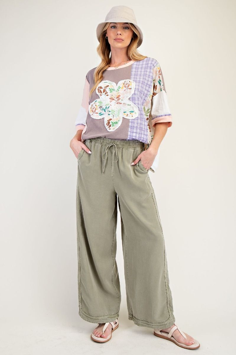 A tee that brings together soft-washed cotton slub, a relaxed boxy silhouette, and standout raised floral patchwork.