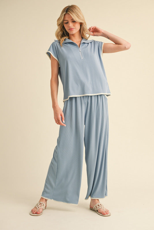2 piece set in cornflower blue with ivory crochet trim. Top is short sleeve.