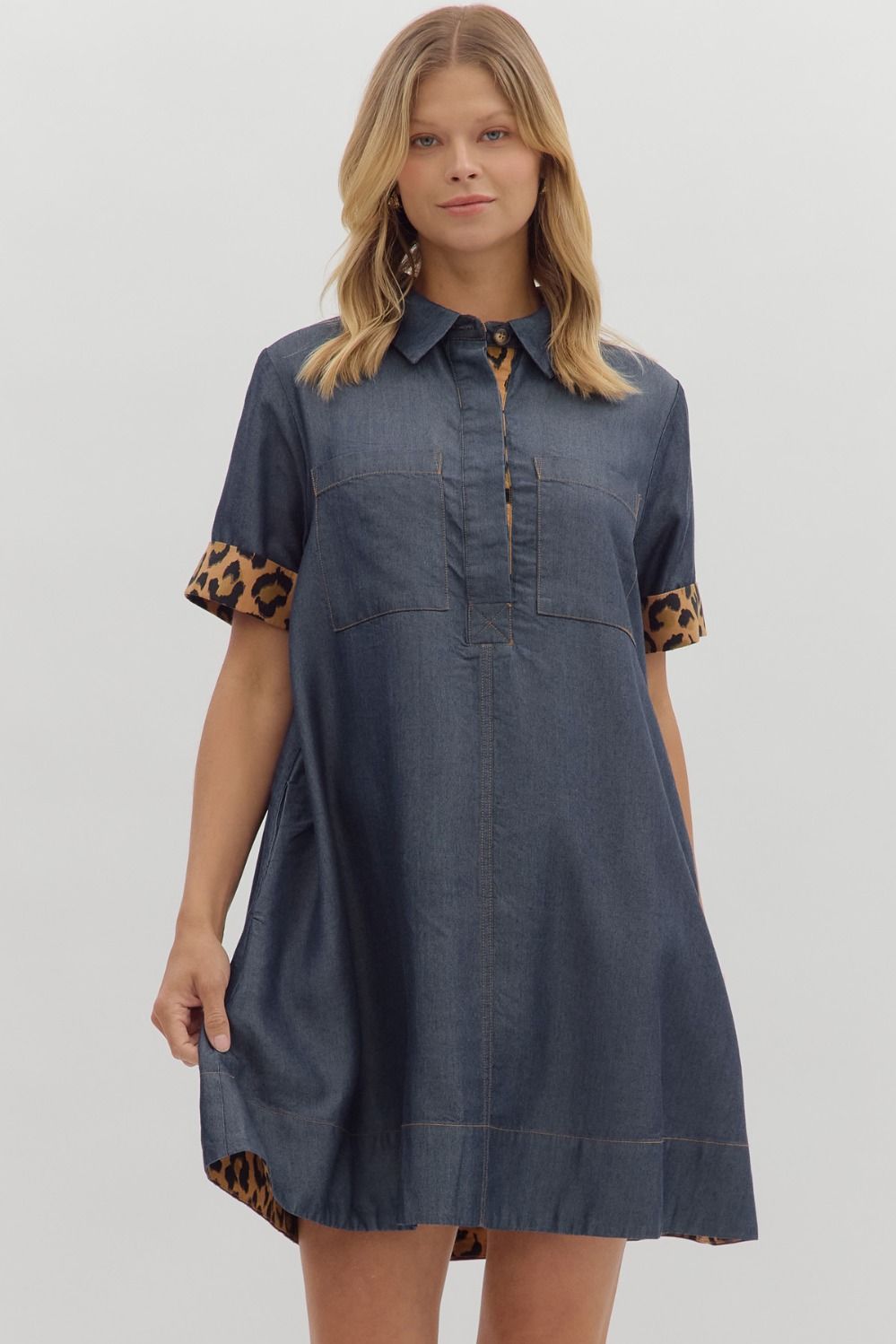 Dark denim dress with cheetah print on outline of sleeves