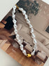 Baroque pearl necklace with gold accent bead in middle 