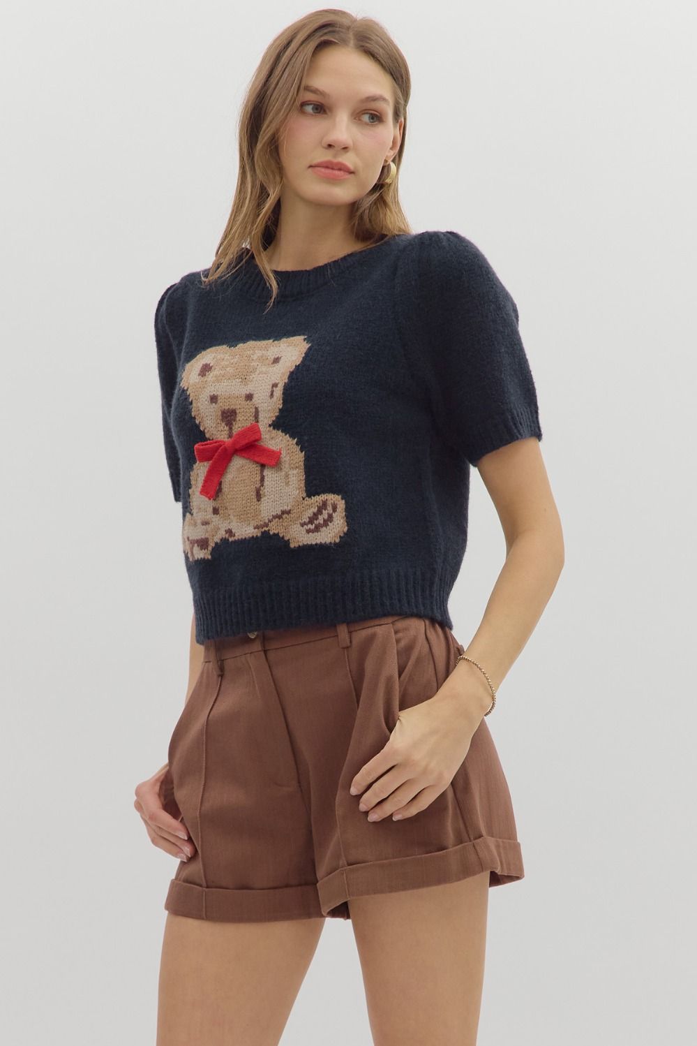 Navy teddy bear with a red bow top 