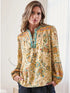 breezy woven blouse features a rich mosaic of golden florals, turquoise accents, and intricate border details