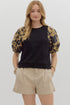 black knit tee gets a bold upgrade with dramatic puff sleeves in a mocha-toned floral print