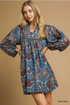 relaxed-fit mini features an intricate paisley and medallion print in a striking mix of blues, burgundy, and soft taupe