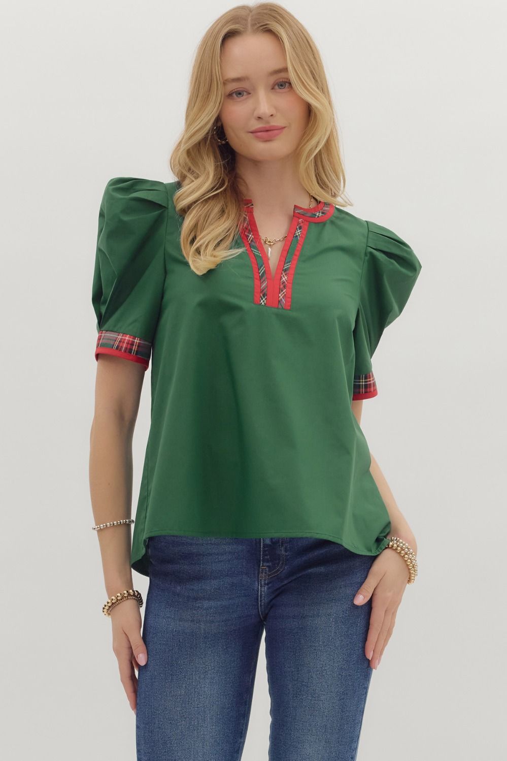 Green v neck puff sleeve top with plaid trim on neck and sleeves