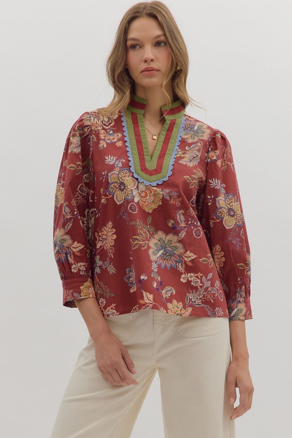 Autumn Sonata Blouse in terracotta with multicolor floral print, scalloped neckline trim, and 3/4 puff sleeves