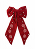 Red bow with white snowflake patterns on a white background