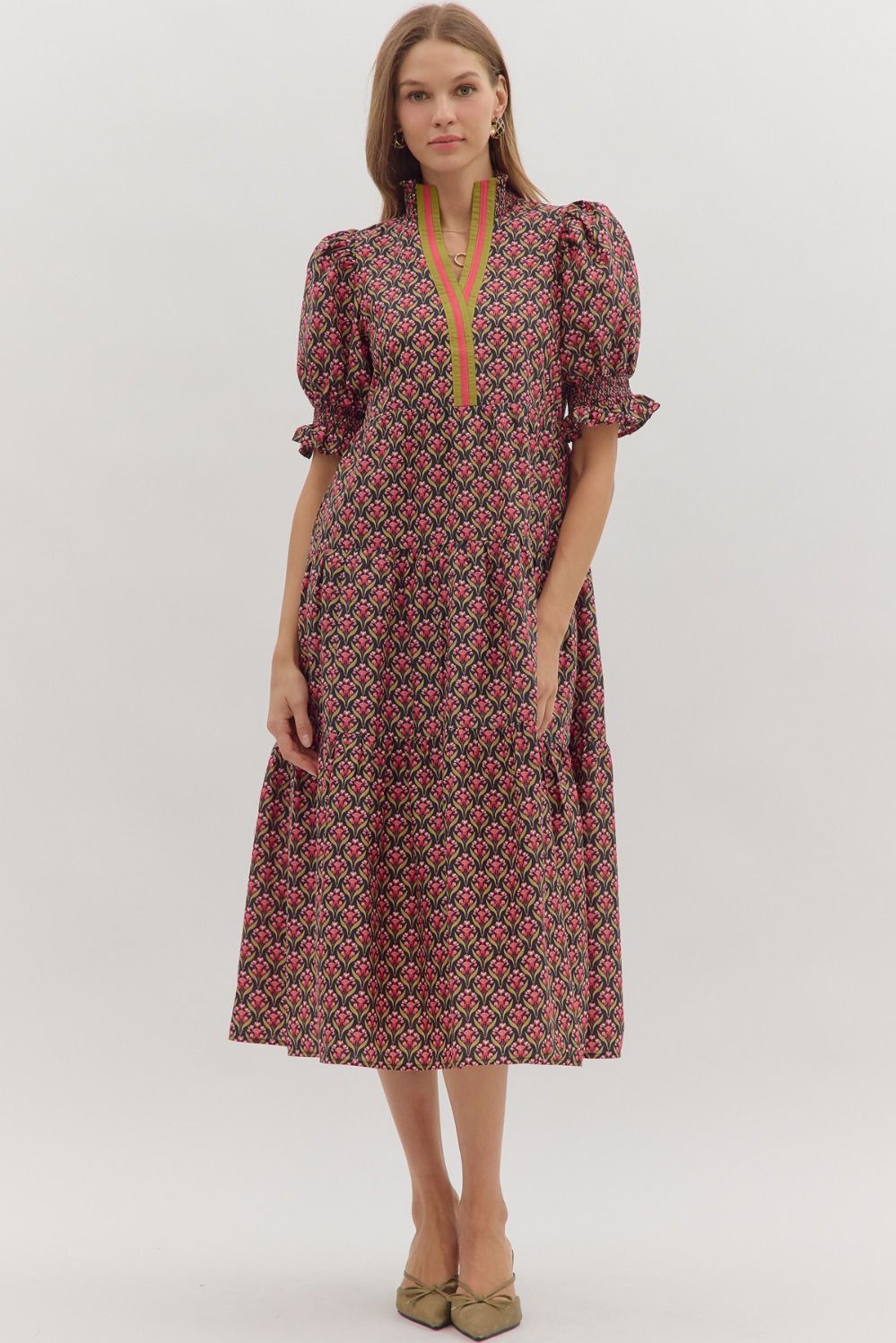 Geometric floral print midi dress with puff sleeves, green contrast trim notched neckline, and relaxed fit