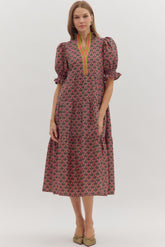 Geometric floral print midi dress with puff sleeves, green contrast trim notched neckline, and relaxed fit