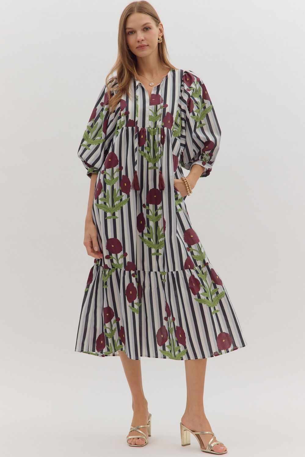 Navy and white striped midi dress with burgundy floral embroidery, tassel tie neckline, and tiered skirt