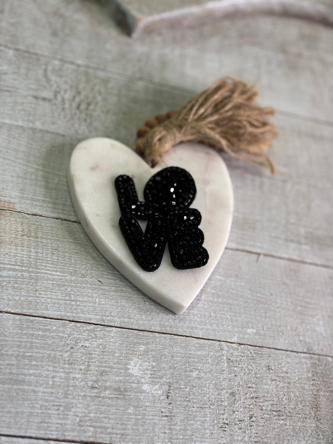 Black brooch shaped like love. 