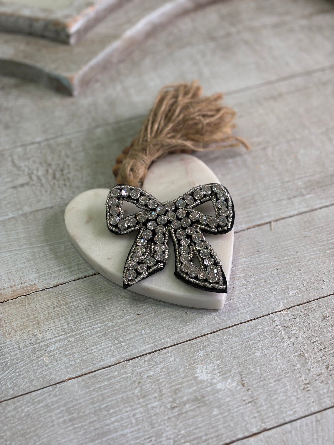 Black and silver bow pin with crystals. 