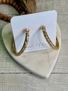 Large gold hammered hoop earrings