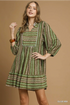 Olive green dress with mid sleeves and v neck slit at top 