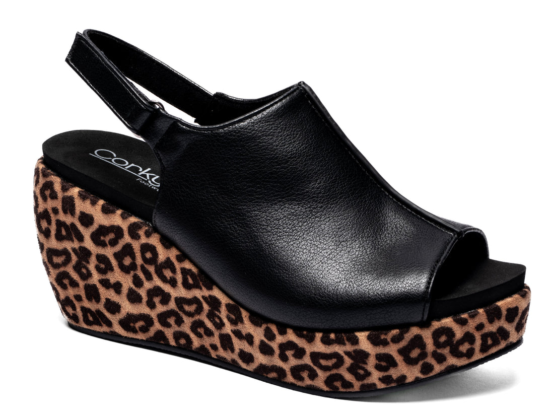 black platform peep toe wedges featuring animal print